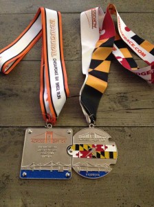 Here's how the 2014 and 2015 Across the Bay 10K medals interlock. (Vanessa Junkin photo)