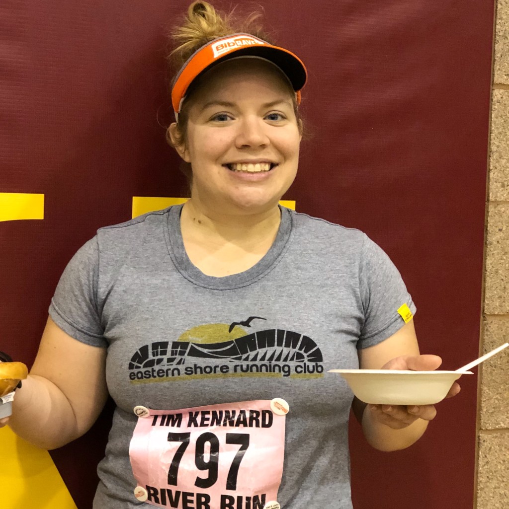 Vanessa Junkin poses with a bowl of food after the Tim Kennard River Run. 