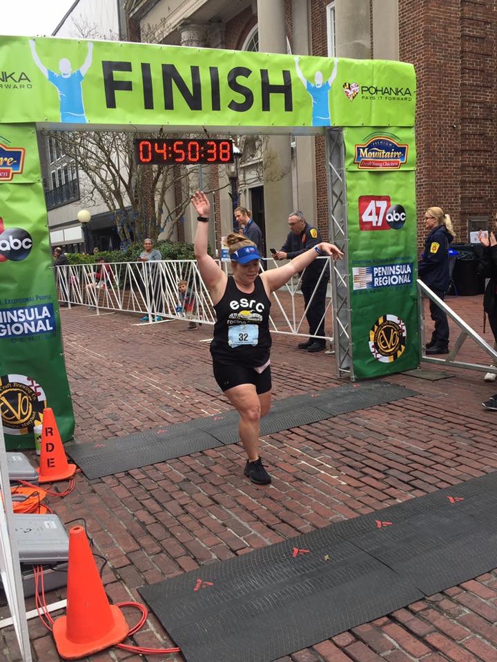 Vanessa Junkin puts her hands up as she finishes the Salisbury Marathon. 