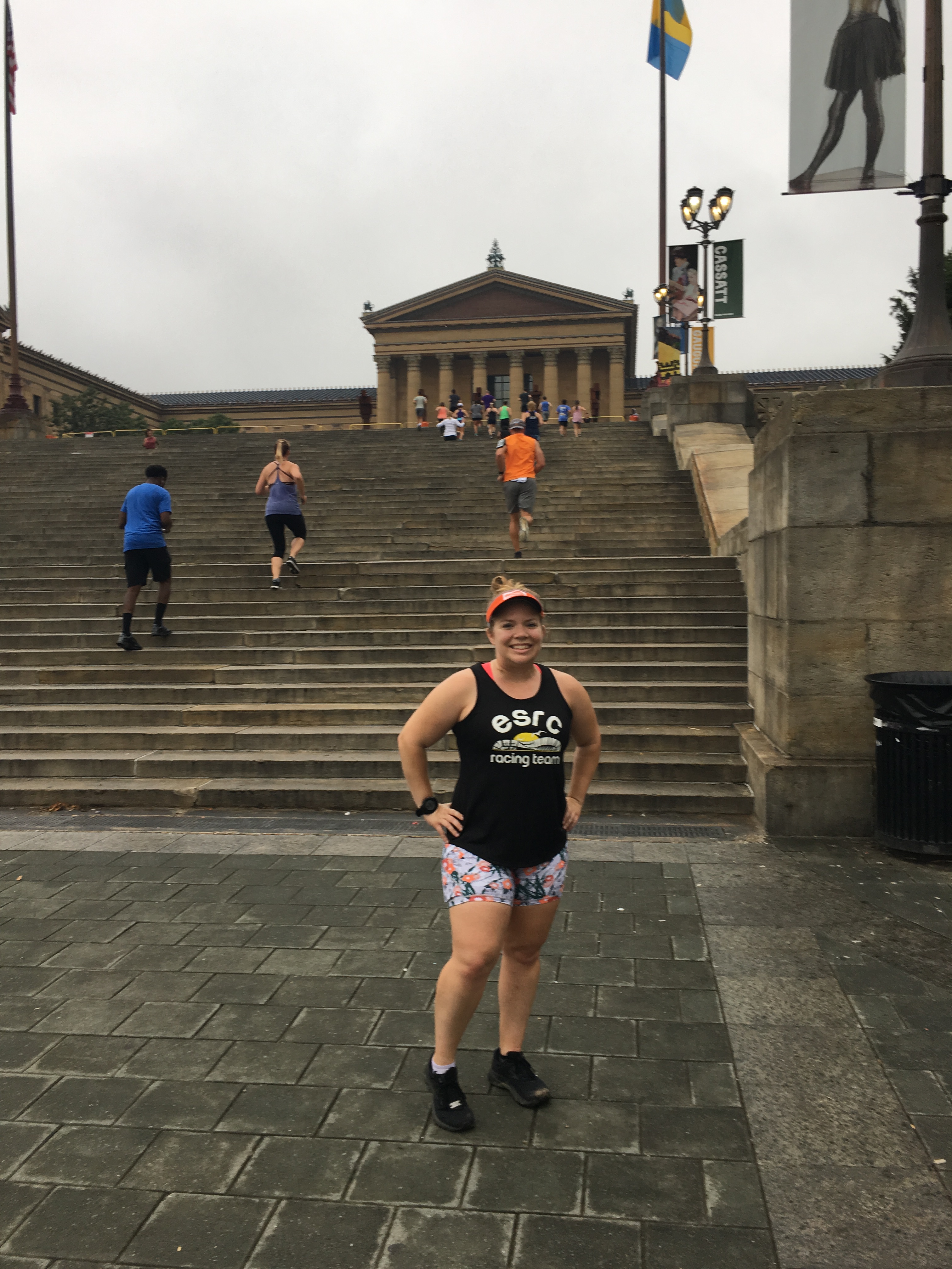 Vanessa Junkin poses in front of the Rocky Steps at the Philadelphia Museum of Art.