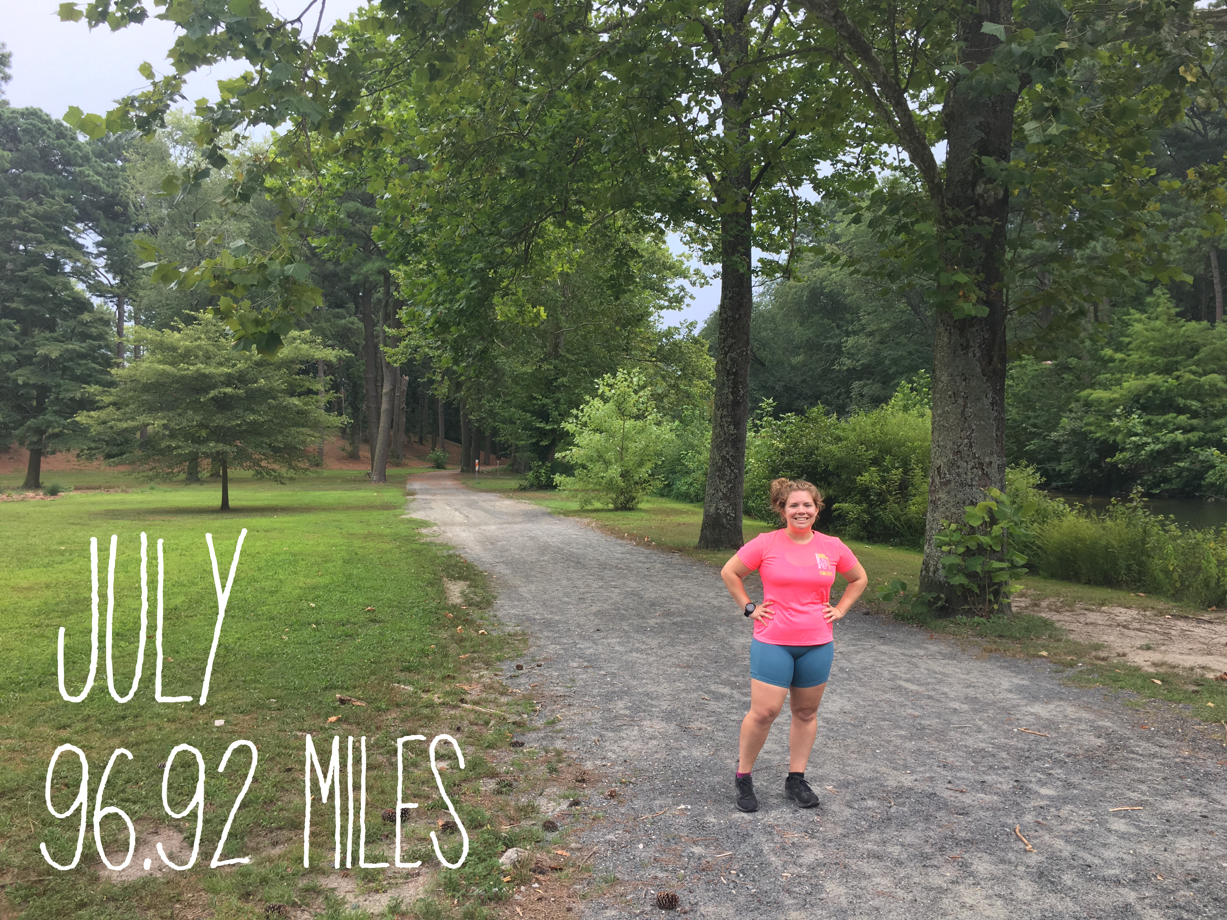 Vanessa Junkin stands on a flat trail at the Salisbury City Park. The photo also has text on it that reads "July 96.92 Miles." 