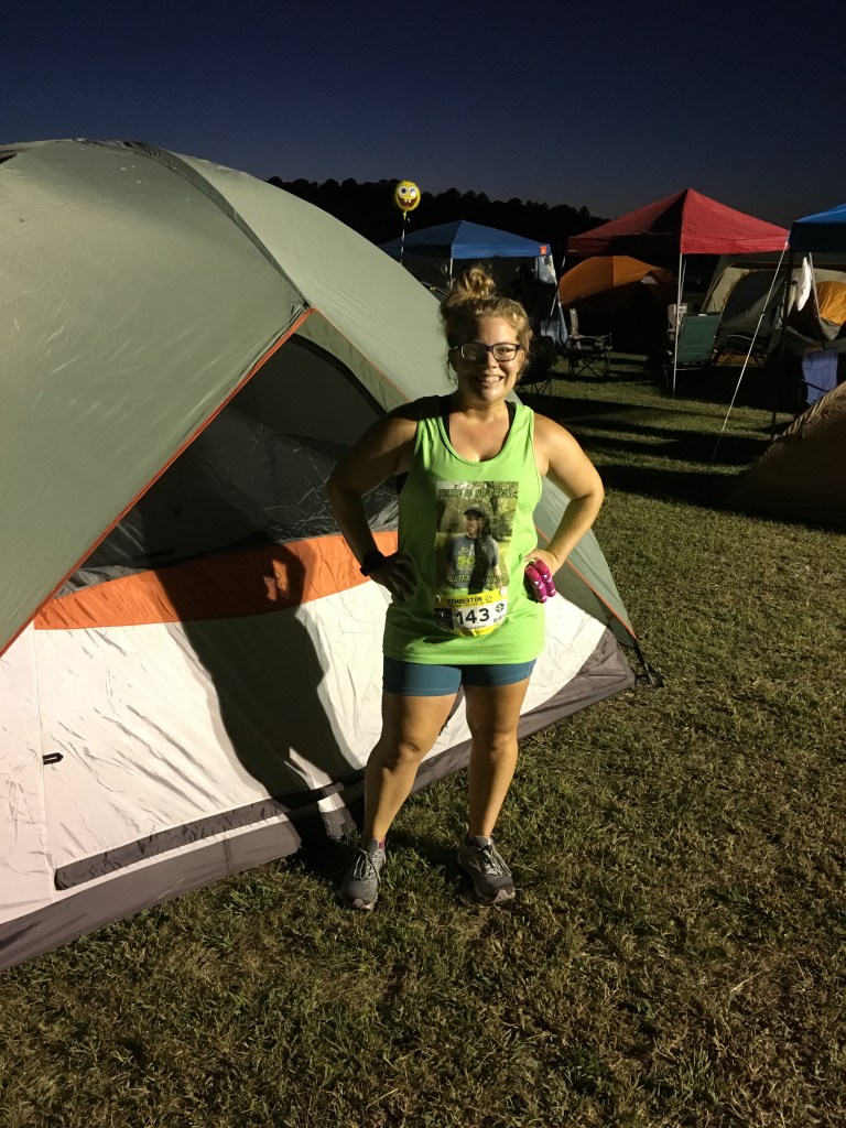 Vanessa Junkin poses in front of her tent at the Pemberton 24. 