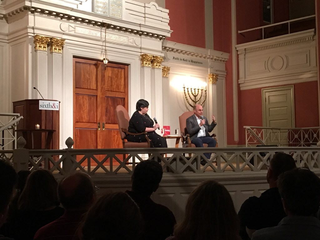 Peter Sagal, right, talks as Linda Holmes moderates at the Sixth & I Historic Synagogue. 