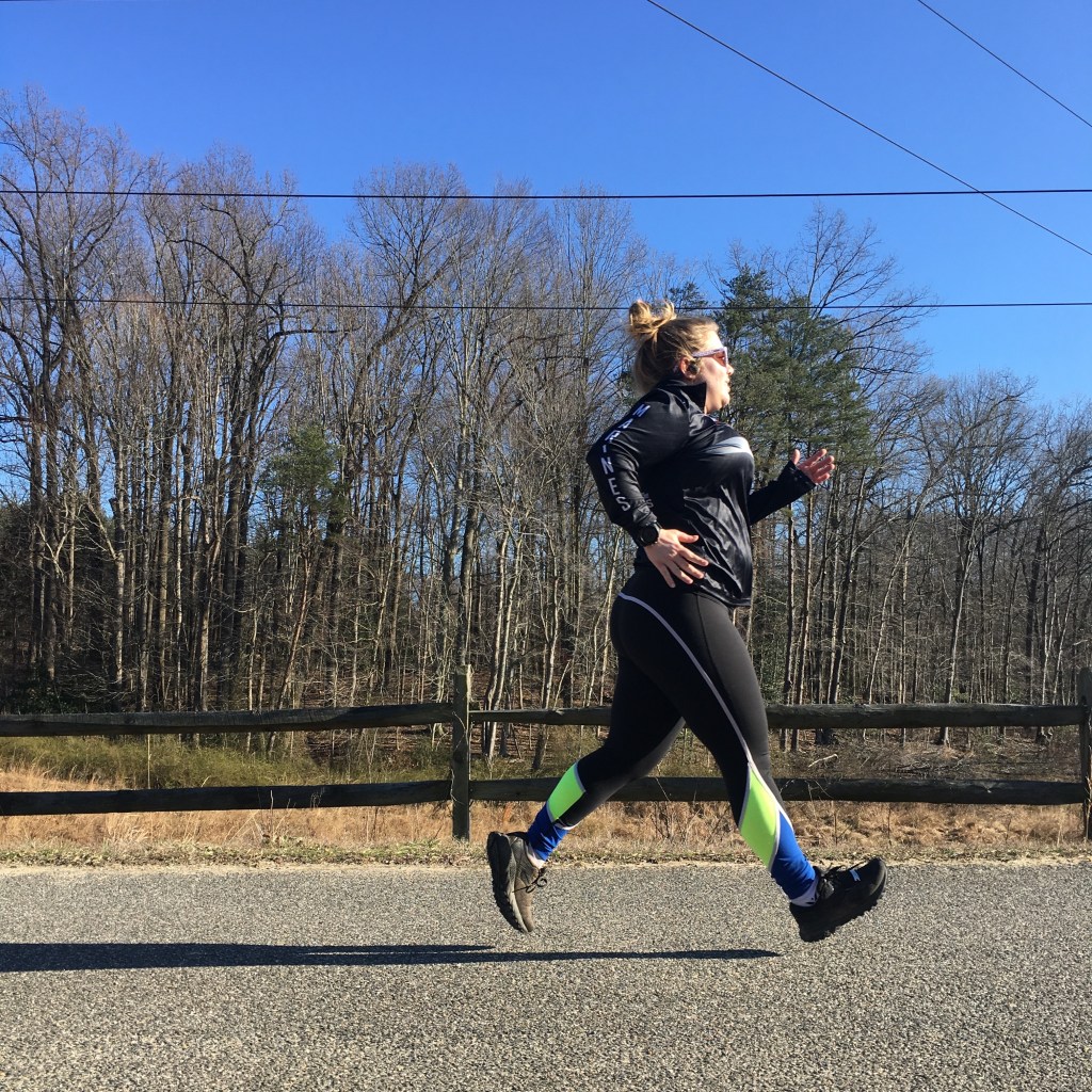 Vanessa Junkin runs on the WB&A Trail in a posed photo, taken from the side.