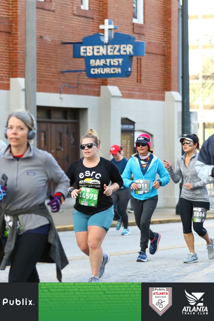 Runners run past Ebenezer Baptist Church.