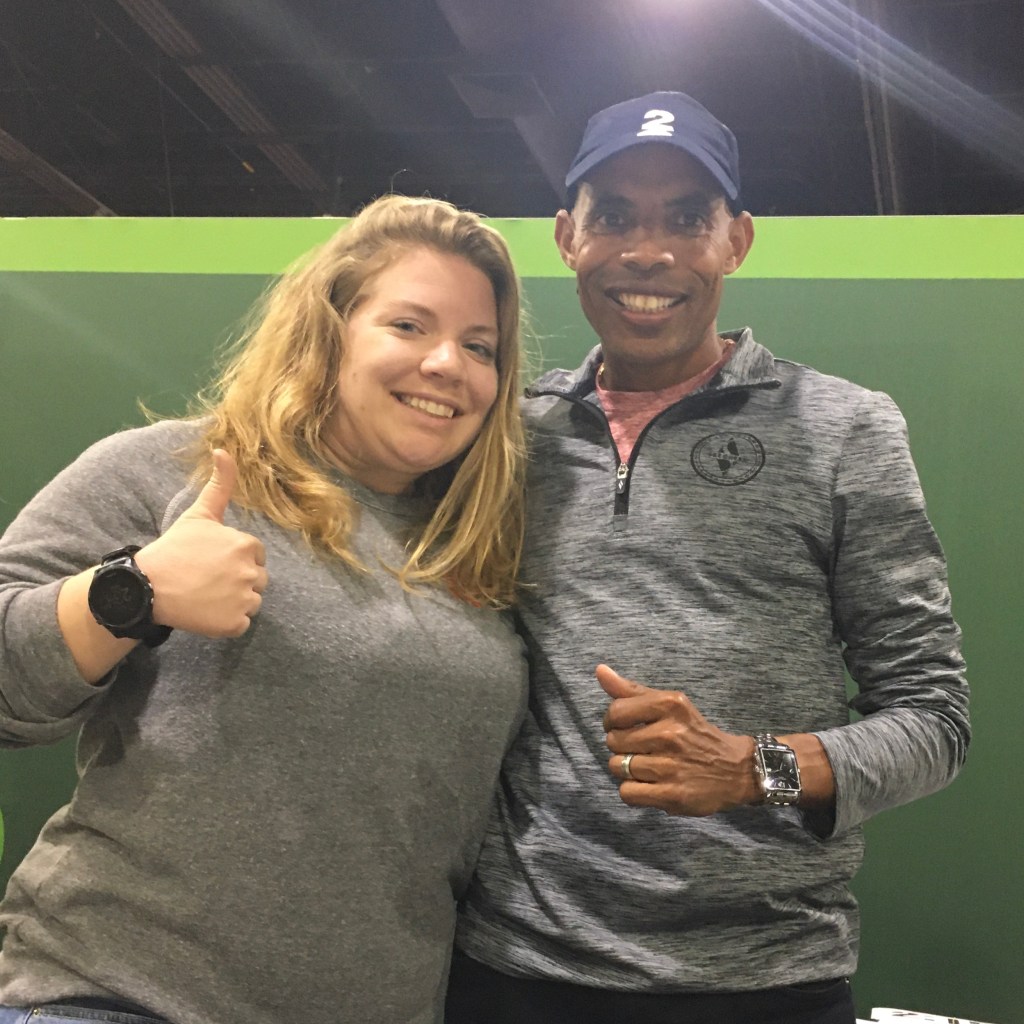 Vanessa Junkin poses with retired pro runner Meb Keflezighi. 