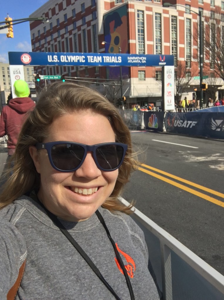 Selfie of Vanessa Junkin in front of the U.S. Olympic Team Trials rectangular arch. 