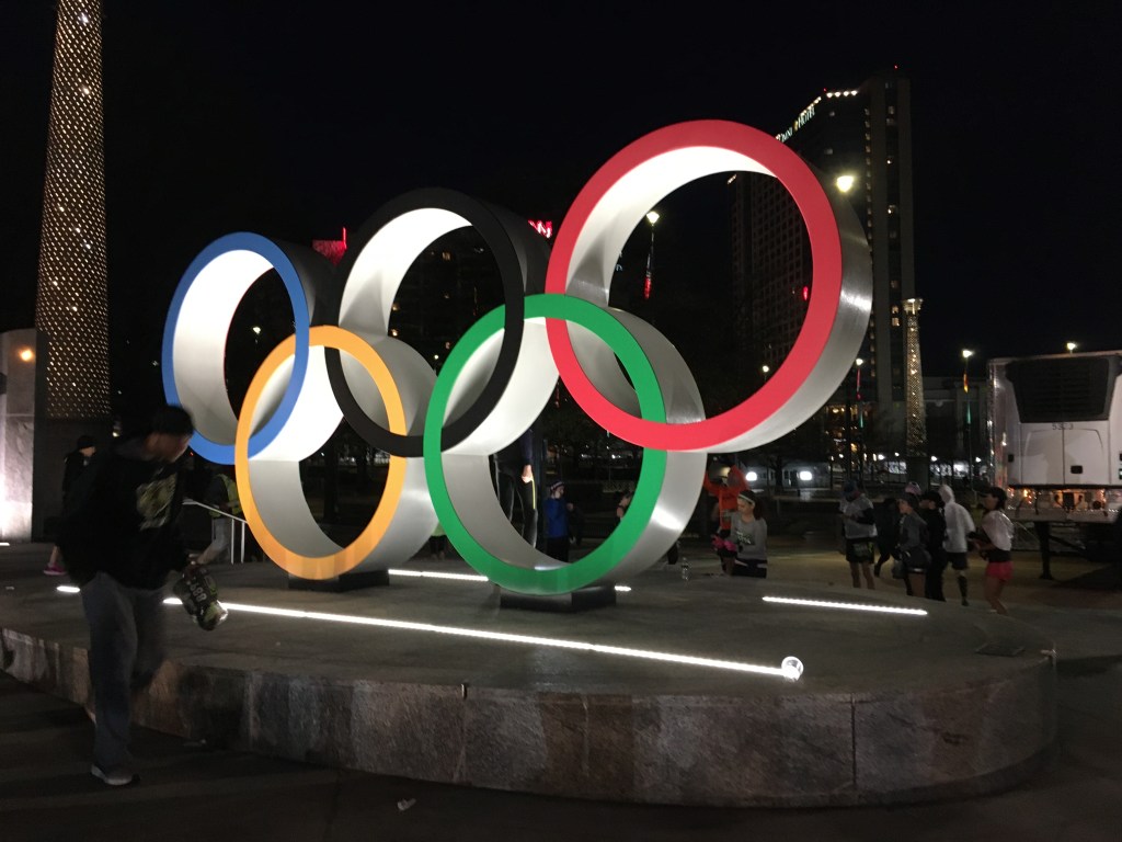 Olympic rings in Centennial Olympic Park, shown at night.