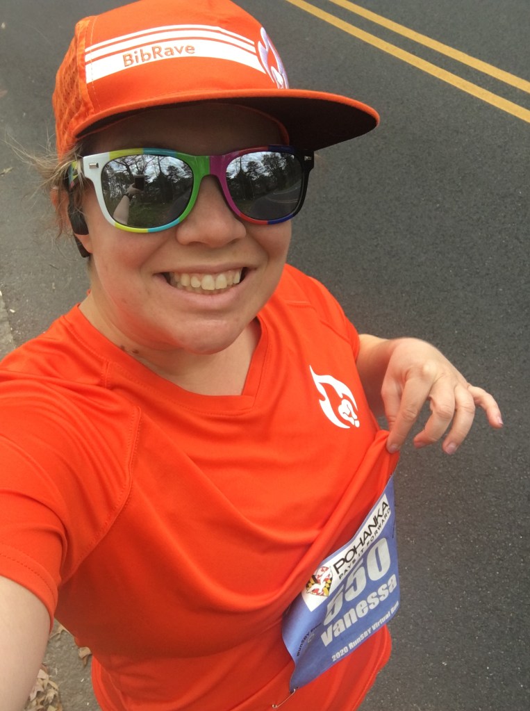 Selfie of Vanessa Junkin showing and wearing race bib.