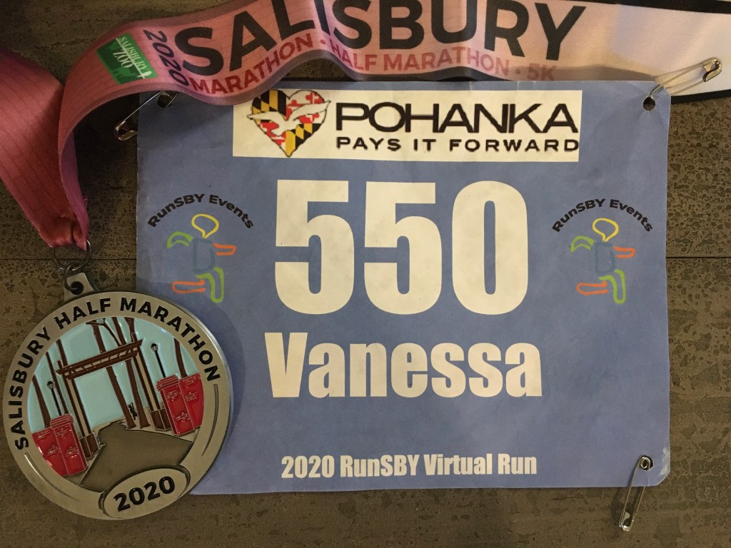 Race bib and medal for the virtual Salisbury Half Marathon