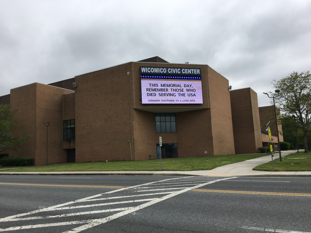 Photo of Wicomico Civic Center with Memorial Day message on marquee that reads "This Memorial Day, remember those who died serving the USA," with "Ceremony postponed to a later date," in smaller font. 
