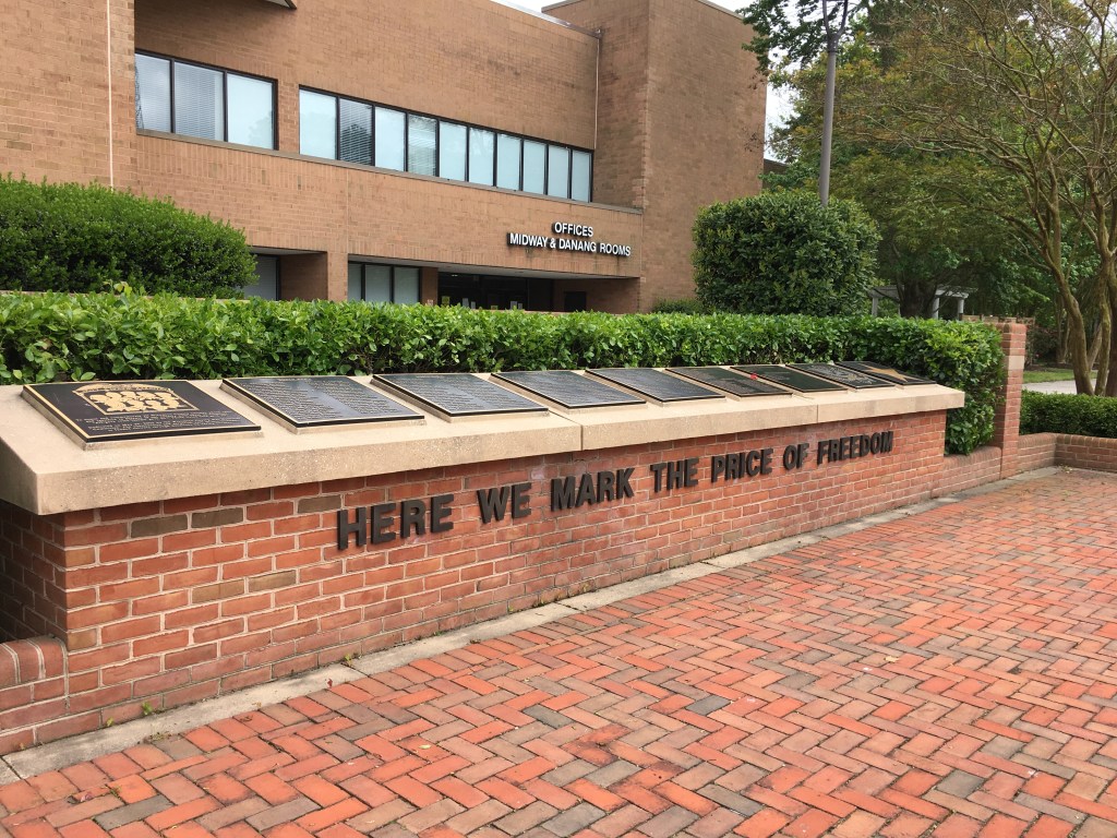 Wicomico War Veterans Memorial outside the Wicomico Civic Center. The memorial reads, "Here we mark the price of freedom," with plaques above.