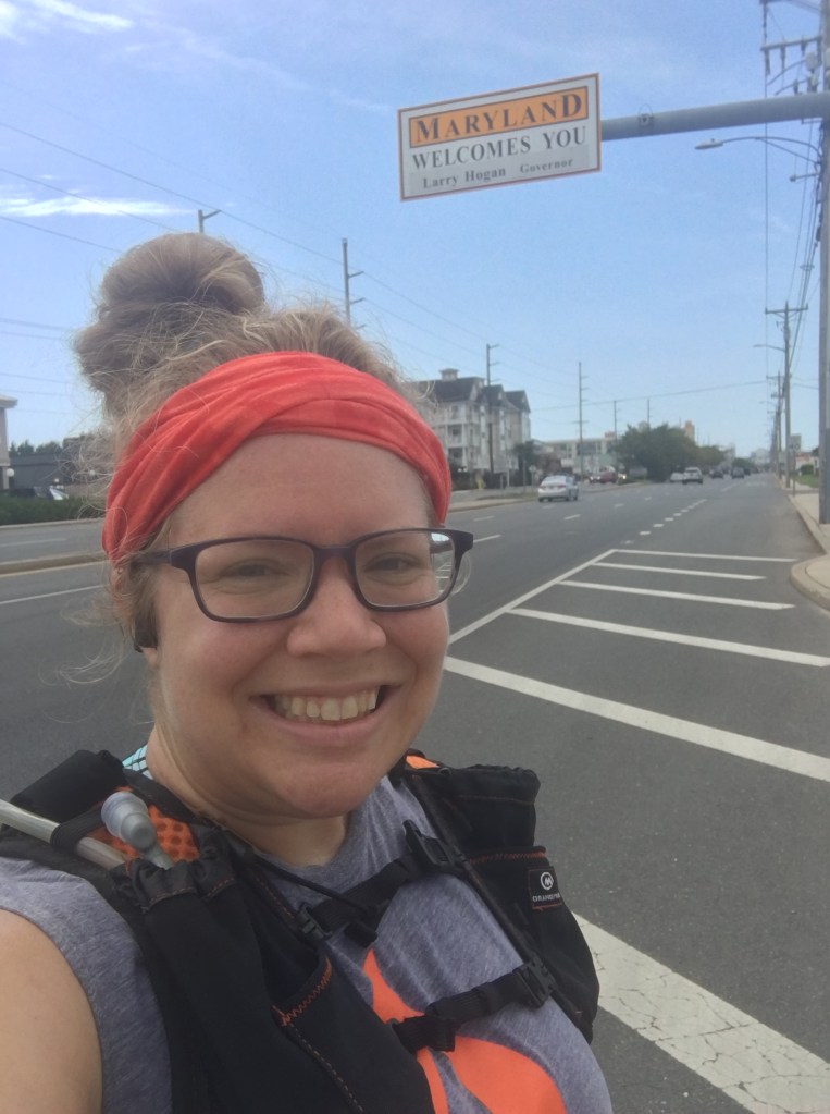 Vanessa Junkin takes a selfie by "Maryland Welcomes You" sign. 