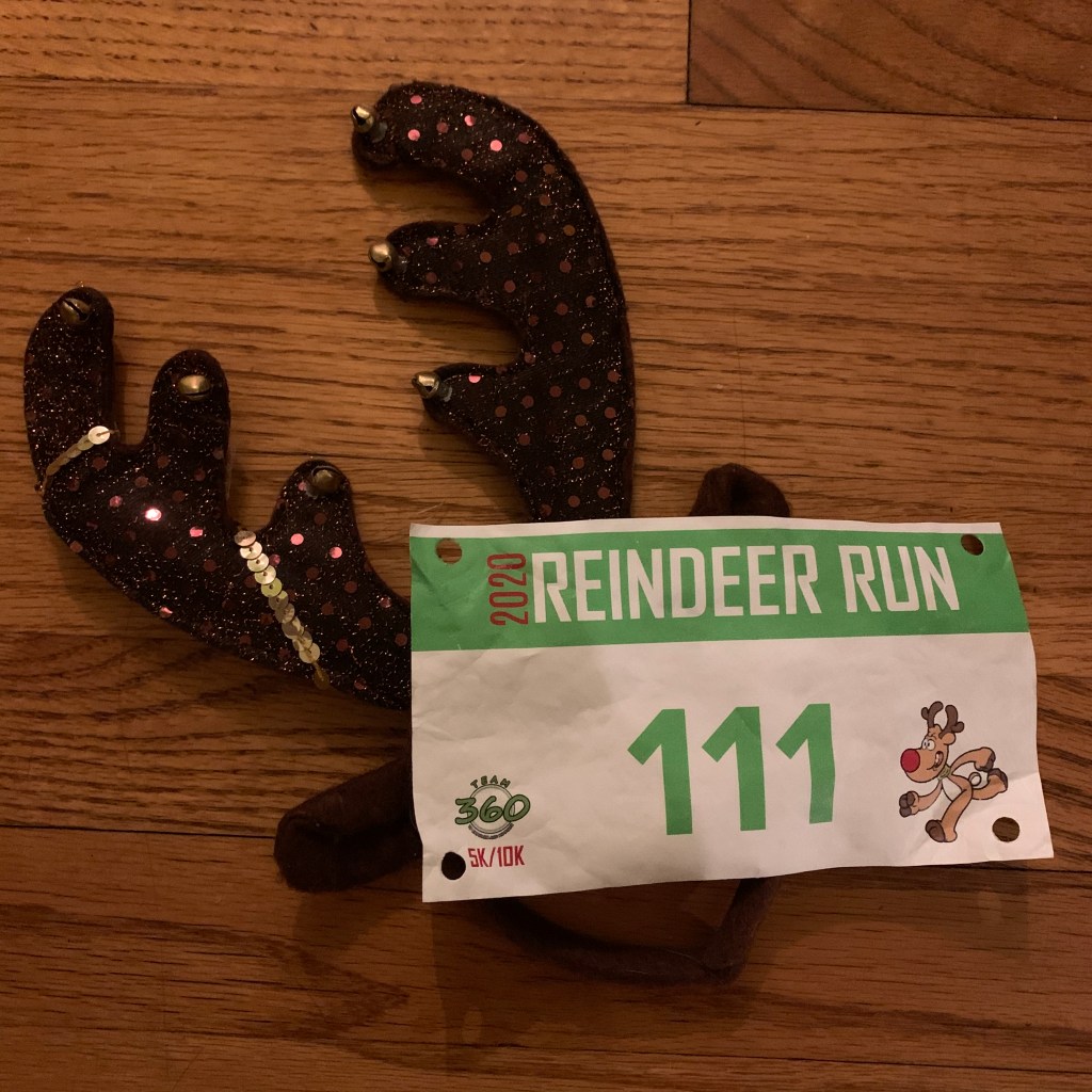 Reindeer Run race bib (number 111) on top of antler headband. 