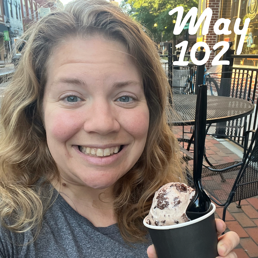 Woman holding a cup of ice cream with the text "May 102."
