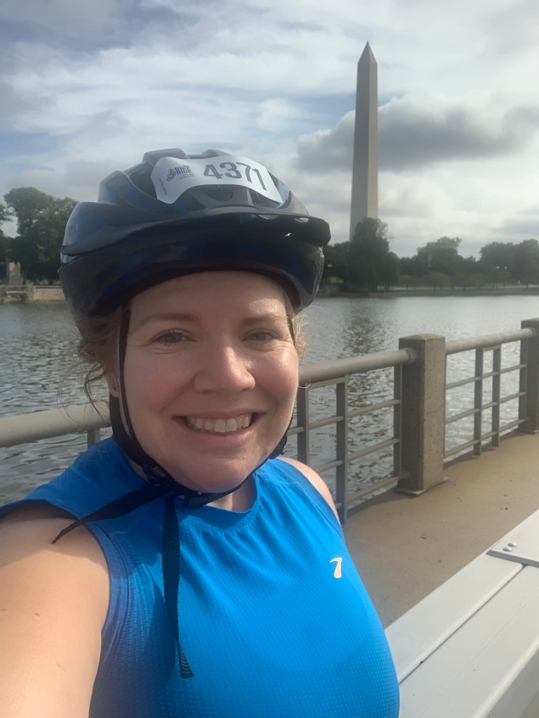 Vanessa Junkin poses in her helmet with the Washington Monument in the background. 