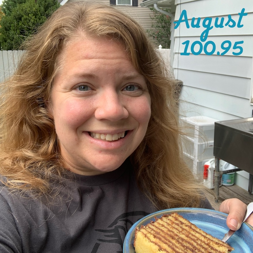 Selfie of Vanessa Junkin holding Smith Island cake with the text "August 100.95."