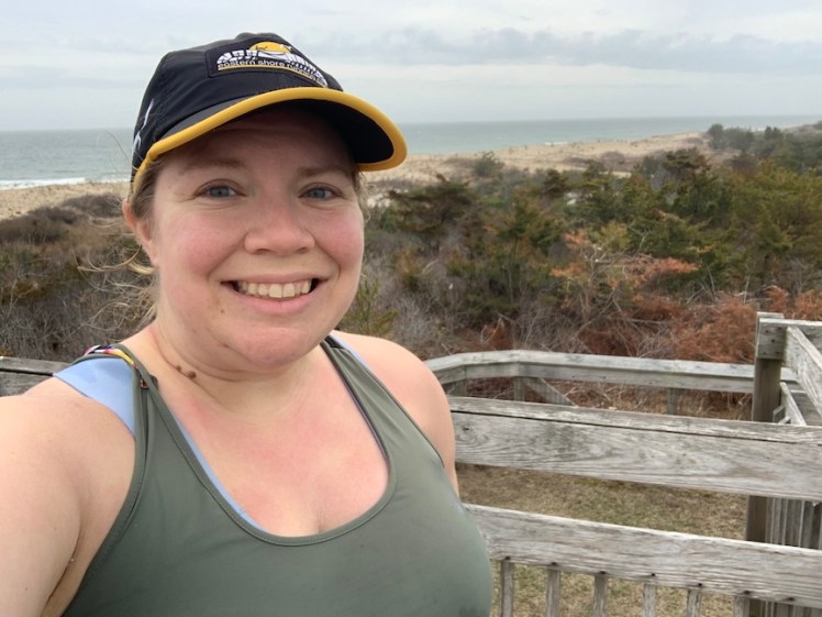 Selfie of Vanessa with the beach in the background