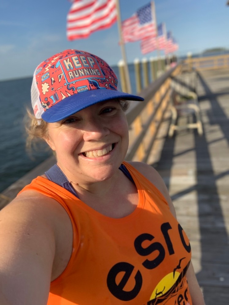 Selfie of Vanessa with flags in the background