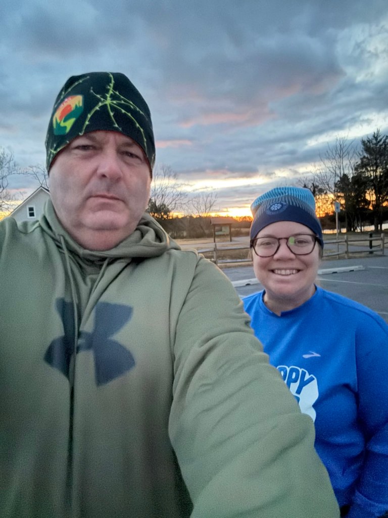 Selfie of man and woman at park at sunrise. 