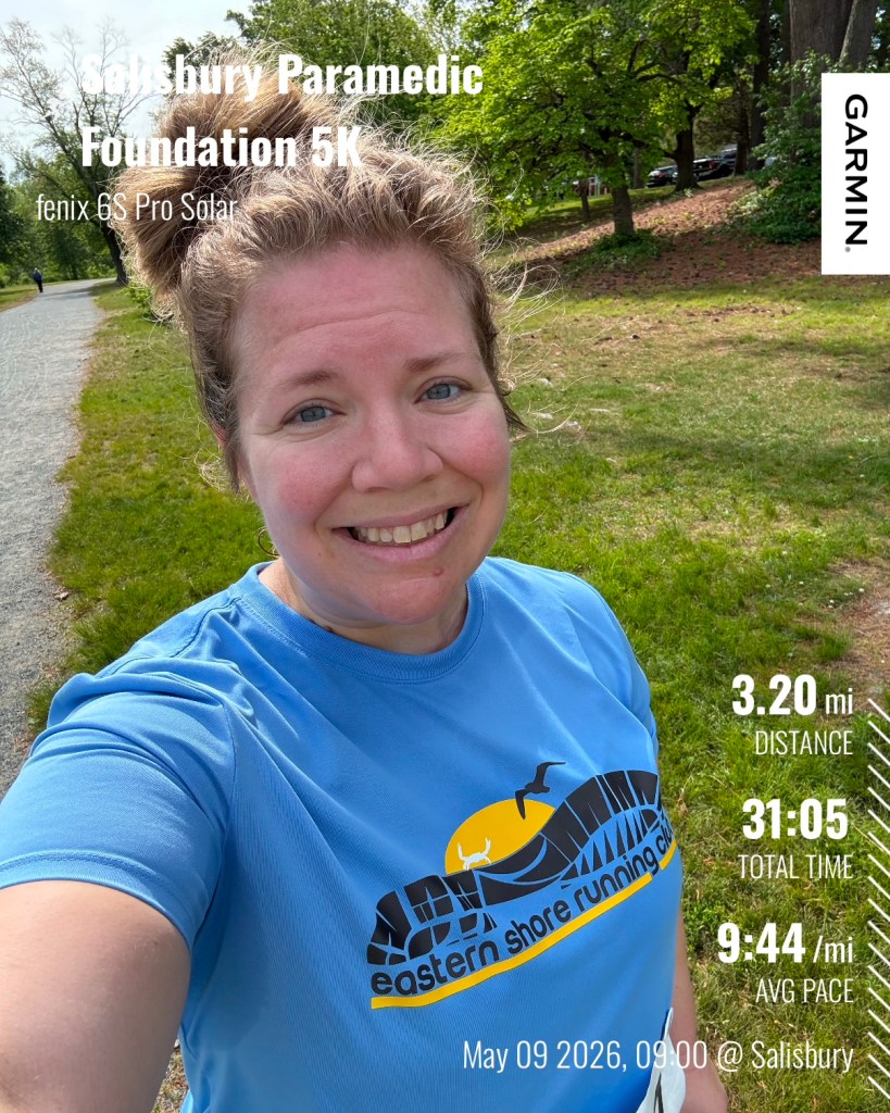 Selfie of smiling runner with a trail in the background. It says "Salisbury Paramedic Foundation 5K" in the top left corner and "3.20 mi Distance, 31:05 Total Time and 9:44/mi Avg Pace May 09 2026, 0900 @Salisbury" in the lower right corner.